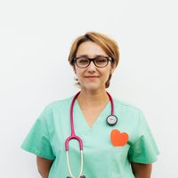 Portrait of a smiling woman, an experienced practitioner.